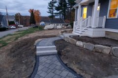 Paver walkway with granite steps and landing; Boulder retaining wall